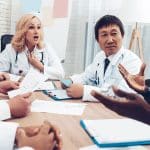 veterinary professionals collaborating in a conference room