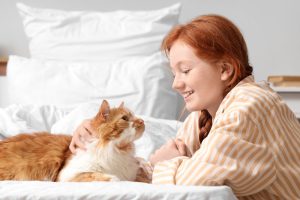 young female with her cat