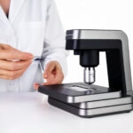 A veterinary professional uses the Vetscan Imagyst analyzer