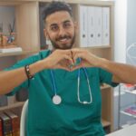 A male veterinary technician in a veterinary hospital
